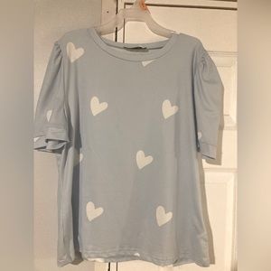 Women’s blue top with white hearts